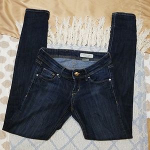 Dark wash super low waist skinny jeans